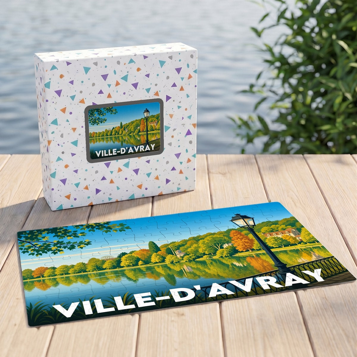 Puzzle souvenir de la ville de Ville-d'Avray avec une illustration stylisée d'un paysage lacustre automnal.