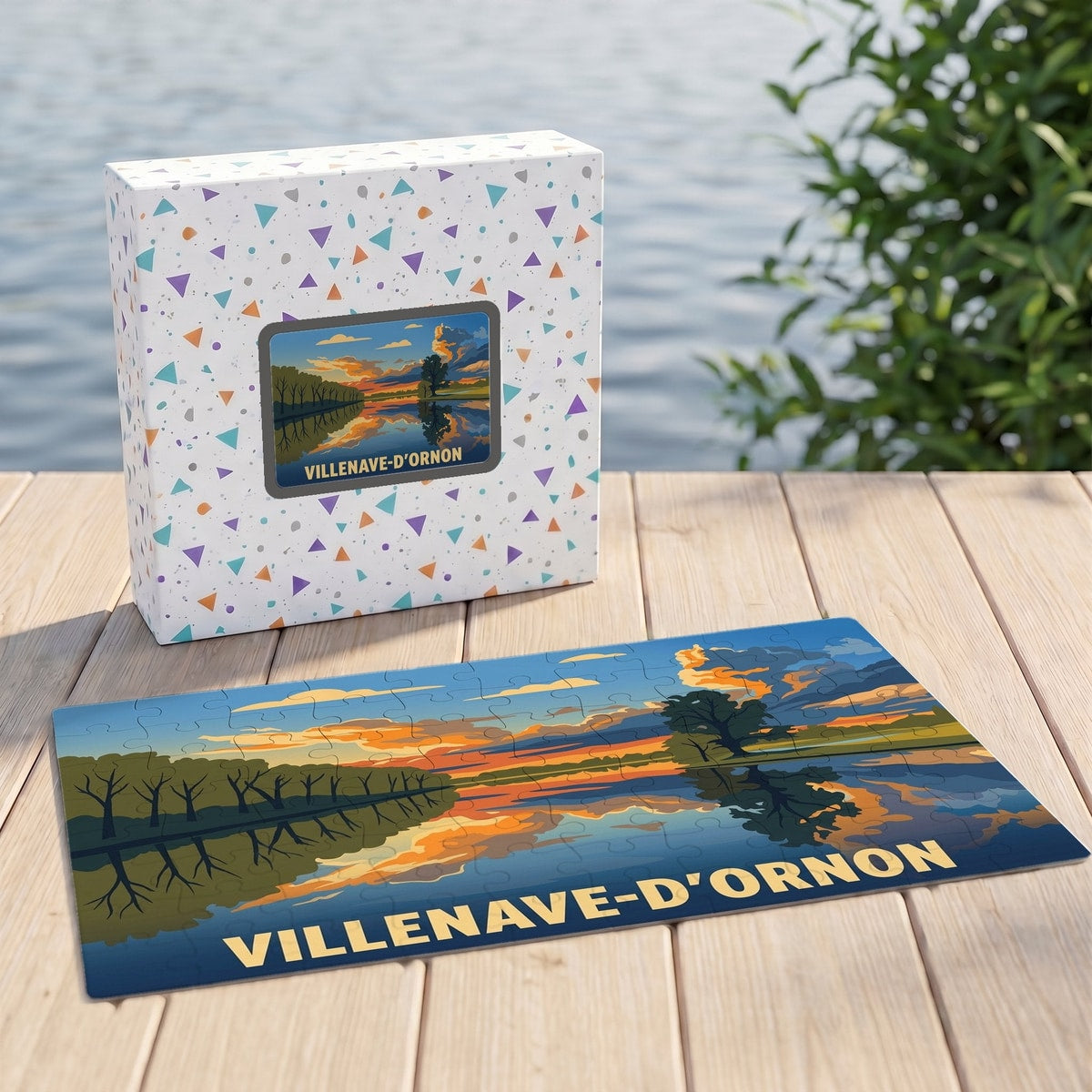 Puzzle souvenir de la ville de Villenave-d'Ornon présentant une illustration stylisée d'un coucher de soleil sur l'eau.