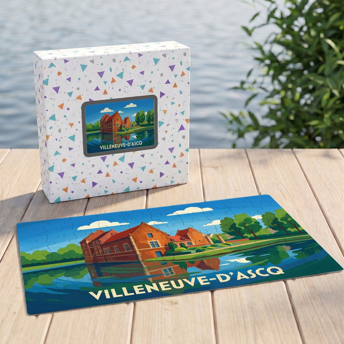 Puzzle souvenir de la ville de Villeneuve-d'Ascq illustré d'un château au bord de l'eau dans son coffret assorti.