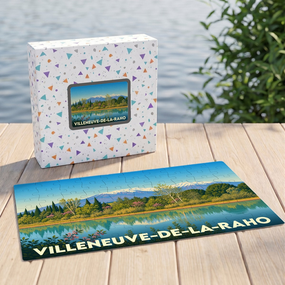 Puzzle souvenir de Villeneuve-de-la-Raho présentant une illustration stylisée du lac et des montagnes.