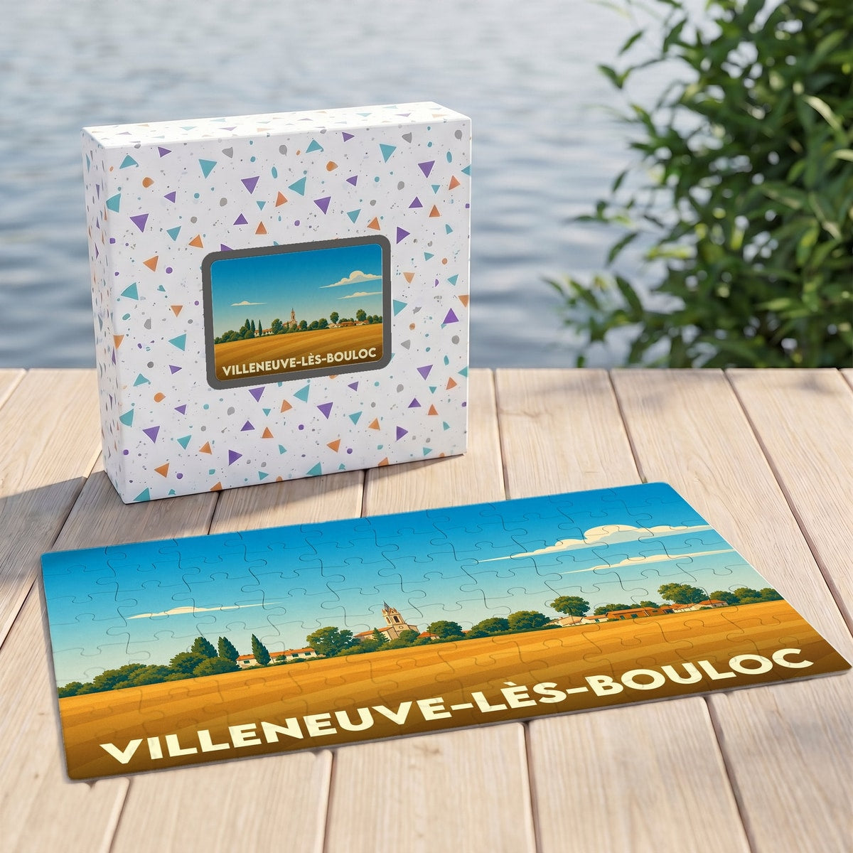 Puzzle souvenir de la ville de Villeneuve-lès-Bouloc avec une illustration champêtre stylisée.