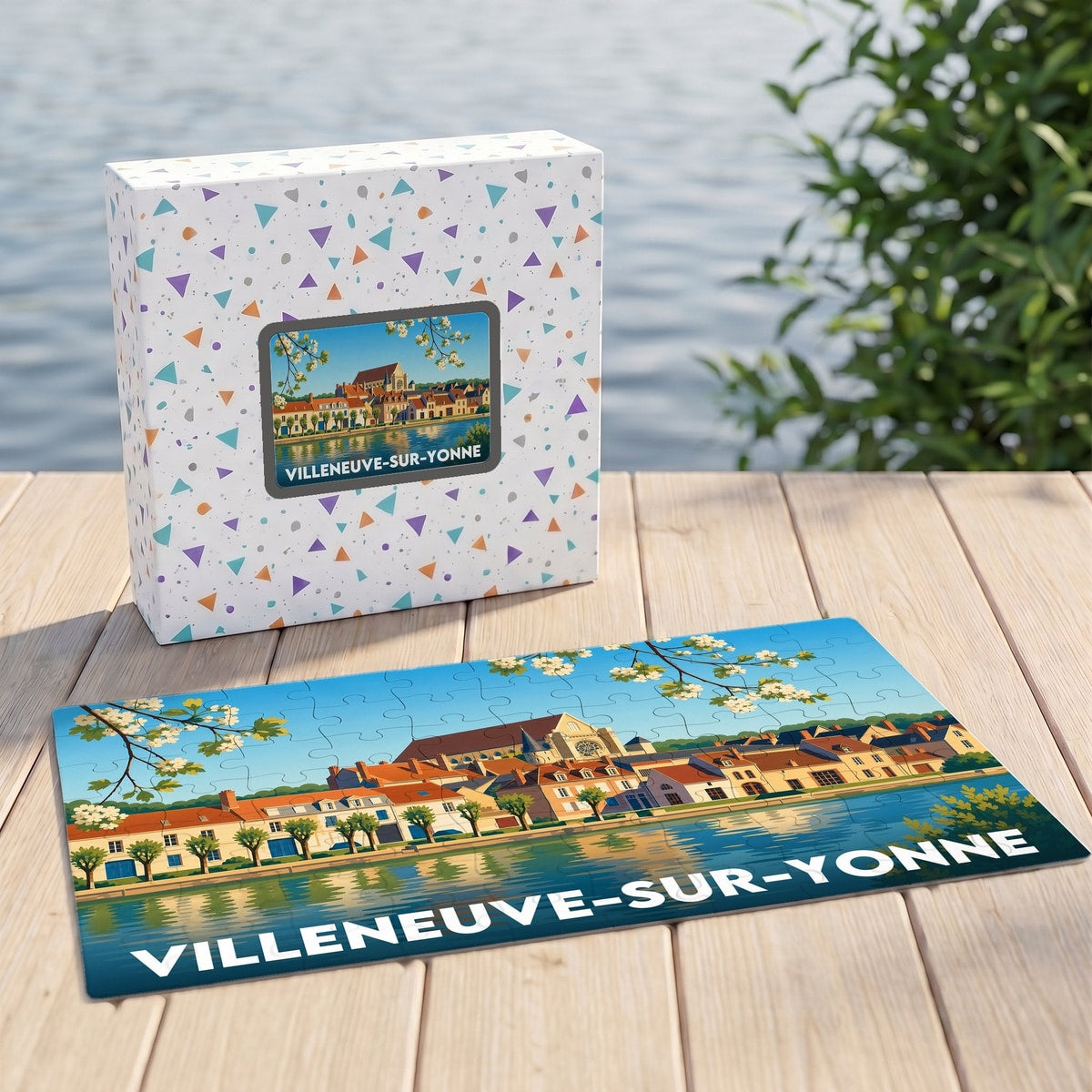 Puzzle souvenir de la ville de Villeneuve-sur-Yonne présentant une illustration stylisée des quais et de l'église au bord de l'eau.