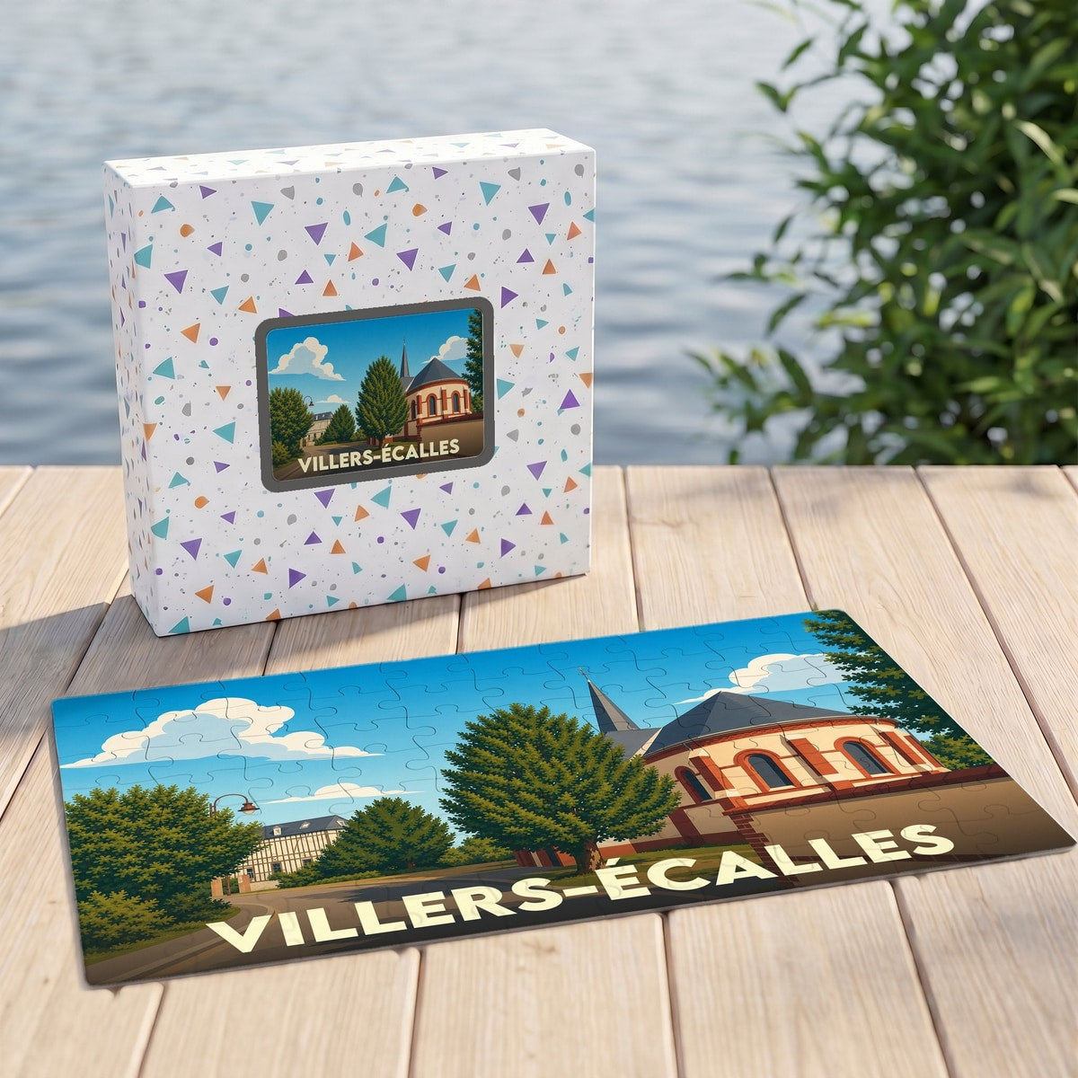 Puzzle souvenir de la ville de Villers-Écalles avec une illustration stylisée d'une église et son boîte assortie.