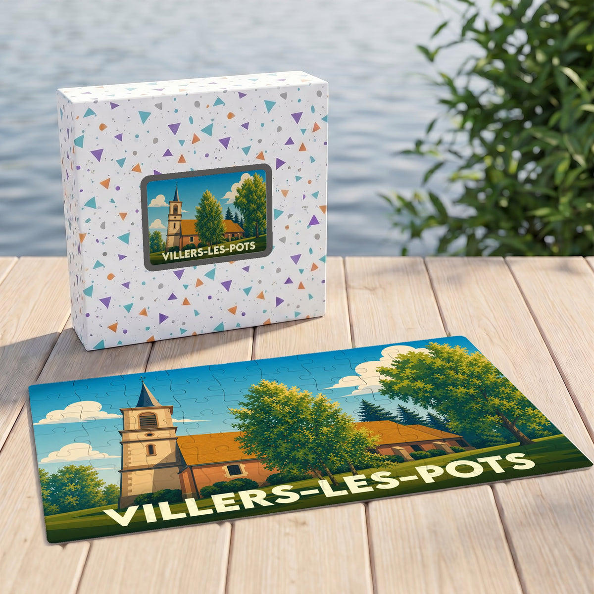 Puzzle souvenir de la ville de Villers-les-Pots avec une illustration stylisée d'une église et de sa boîte assortie.
