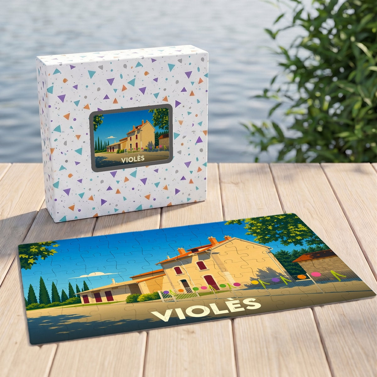 Puzzle souvenir de la ville de Violès avec une illustration stylisée d'un bâtiment provençal.