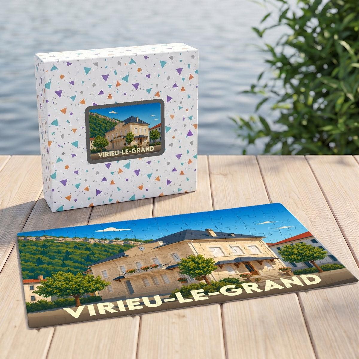 Puzzle souvenir de la ville de Virieu-le-Grand avec son coffret illustré d'un paysage stylisé.