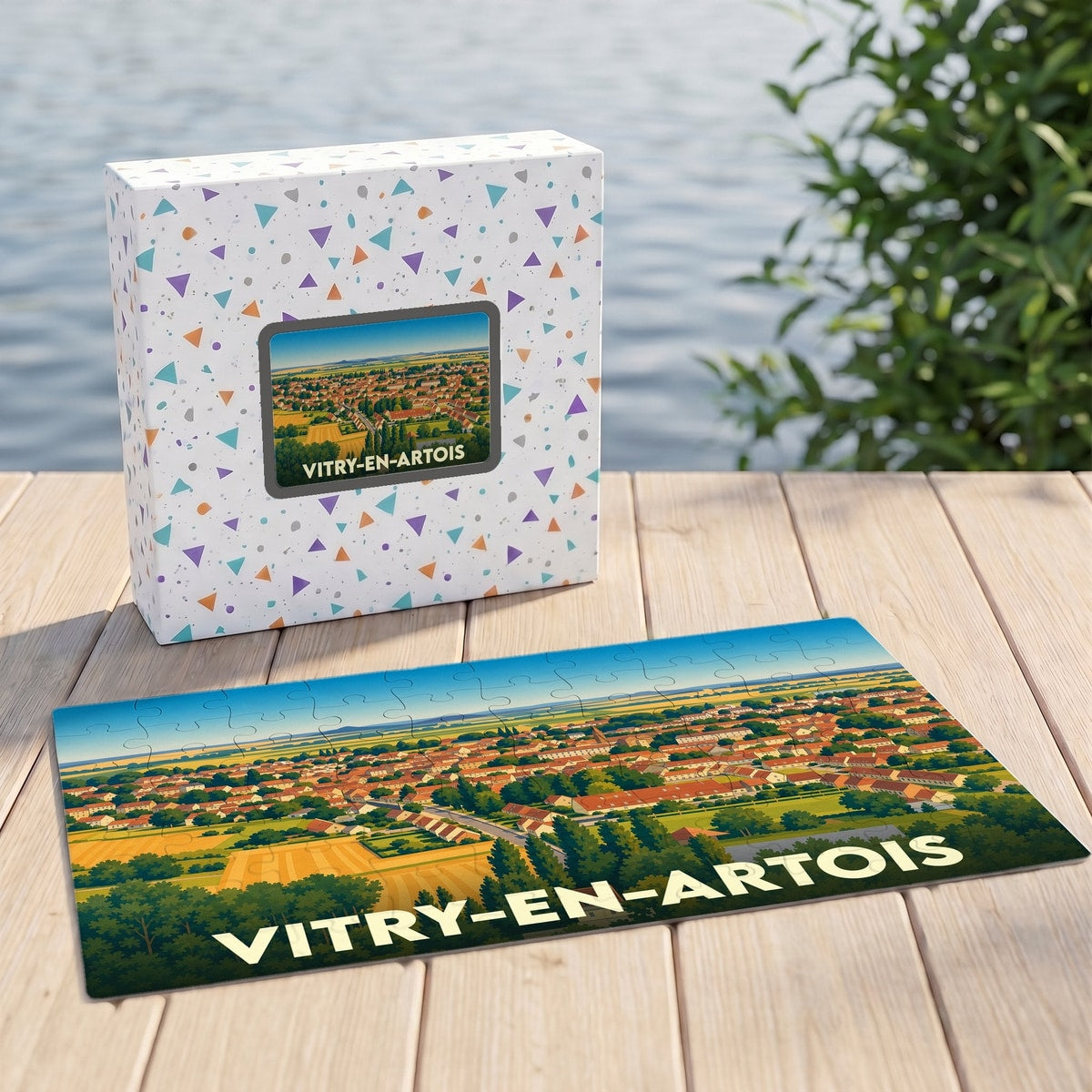 Puzzle souvenir de la ville de Vitry-en-Artois illustré par une vue aérienne stylisée.