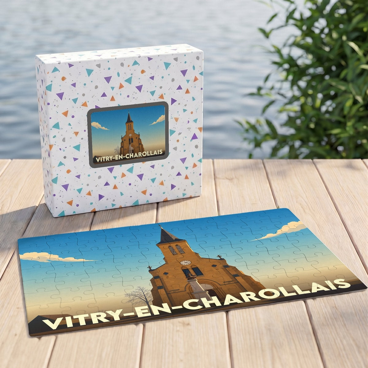 Puzzle souvenir de la ville de Vitry-en-Charollais avec une illustration stylisée de son église sous un ciel azur.