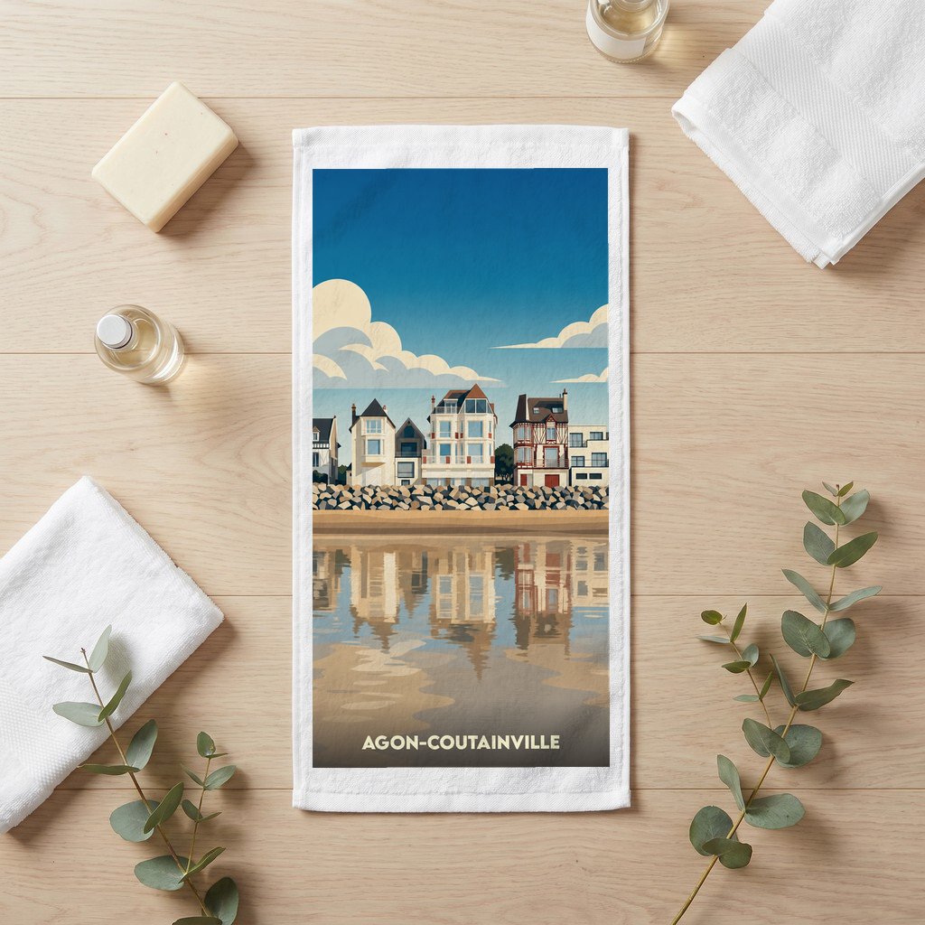 Serviette de bain souvenir de la ville d'Agon-Coutainville illustrée d'un paysage côtier stylisé.