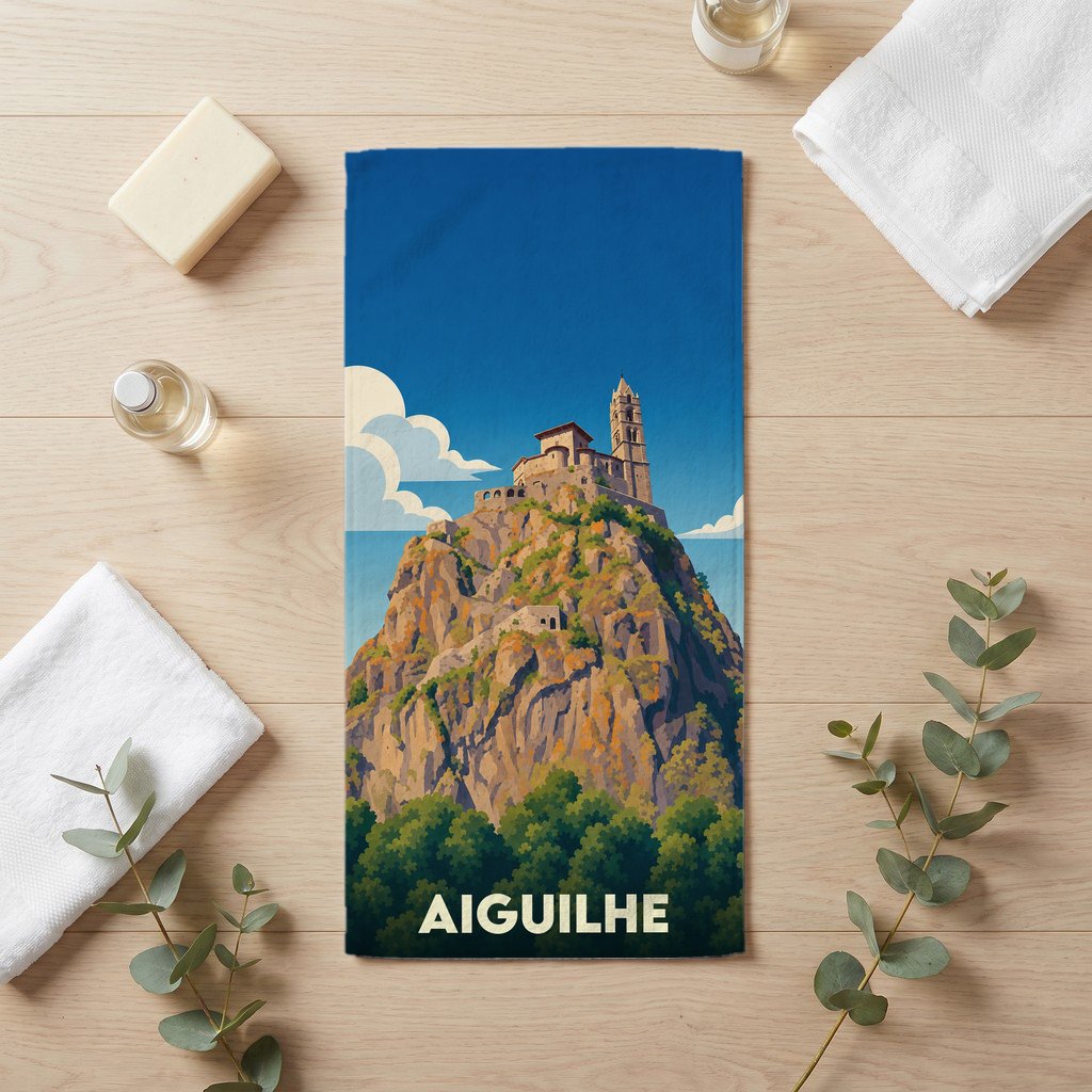 Serviette de bain souvenir de la ville d’Aiguilhe illustrant le rocher Saint-Michel.