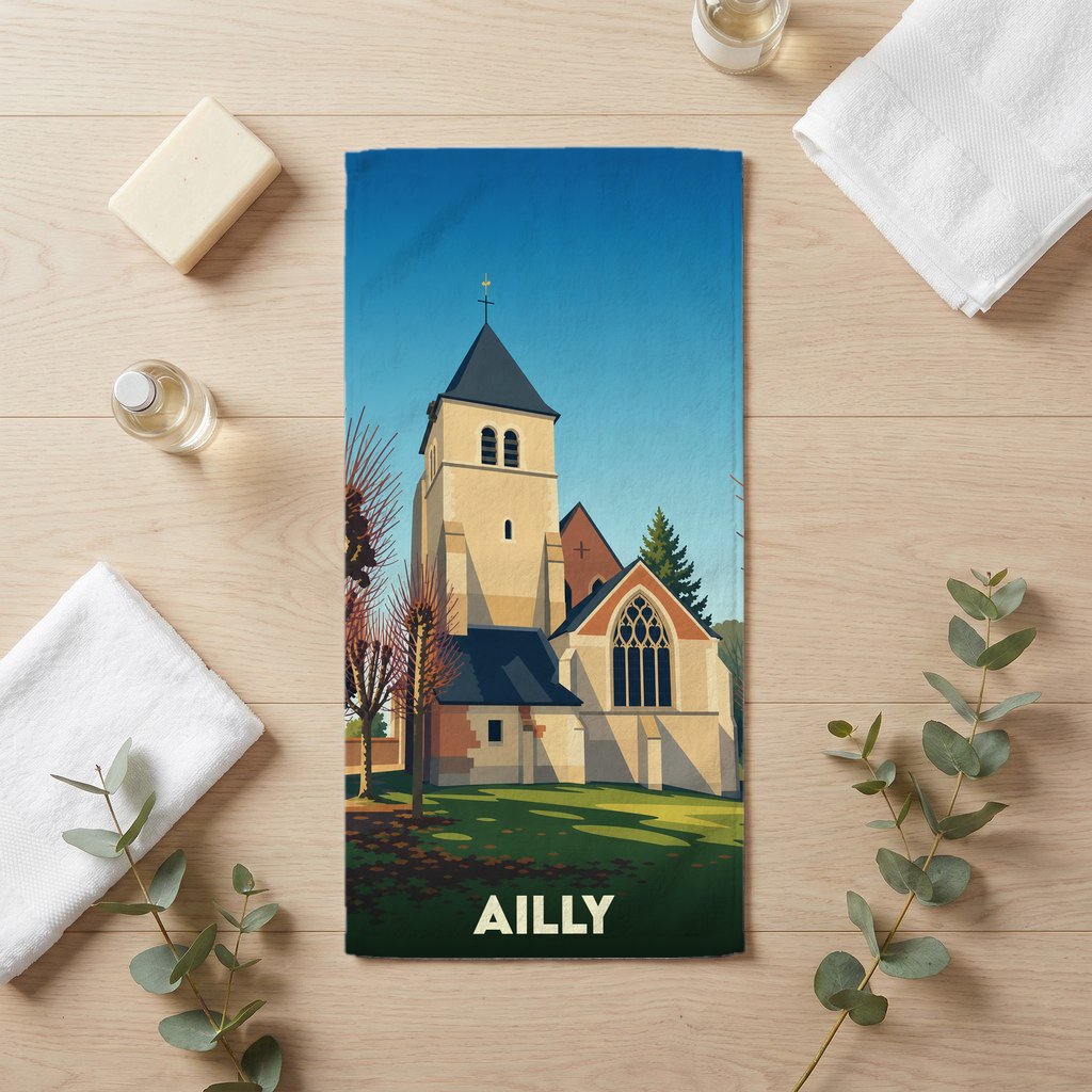Serviette de bain souvenir de la ville d'Ailly avec une illustration stylisée d'une église.