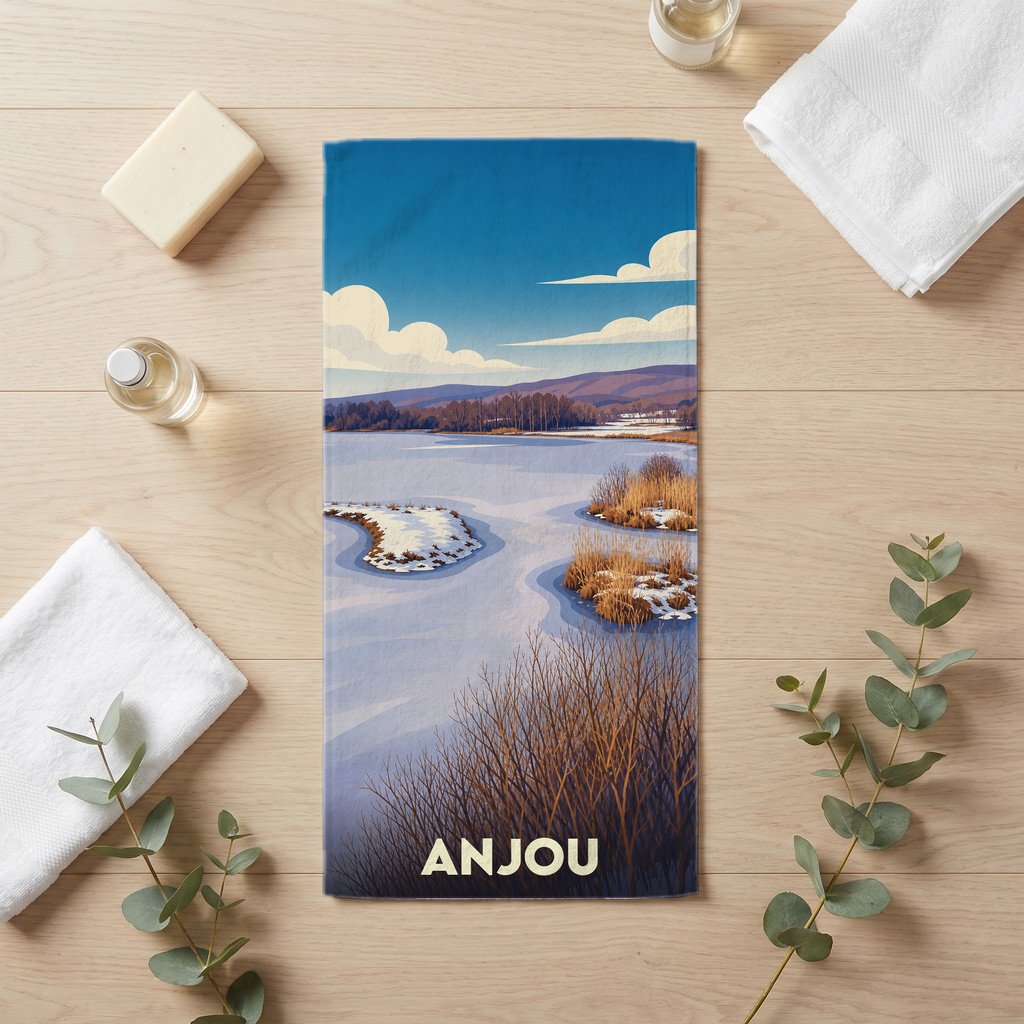 Serviette de bain souvenir de la ville d'Anjou avec une illustration stylisée d'un paysage hivernal.