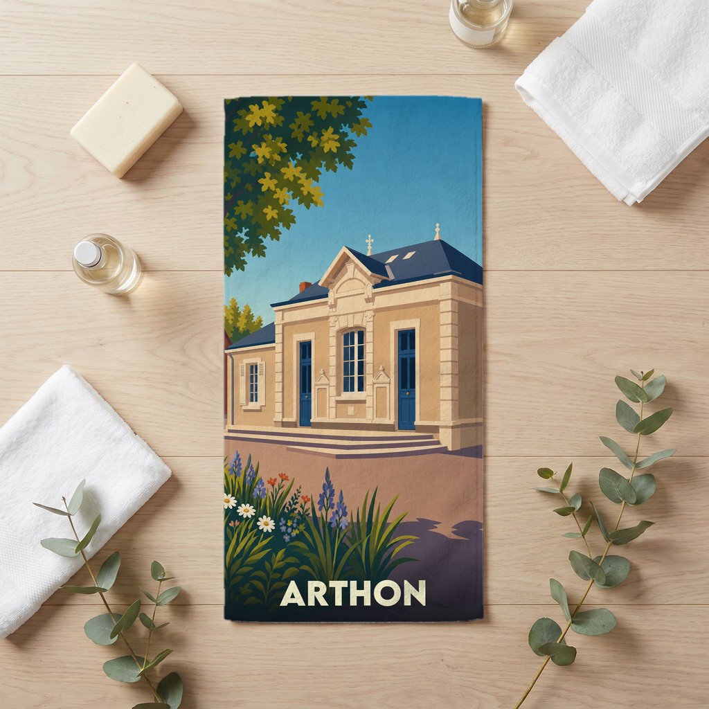 Serviette de bain souvenir de la ville d'Arthon avec une illustration stylisée d'un bâtiment historique.