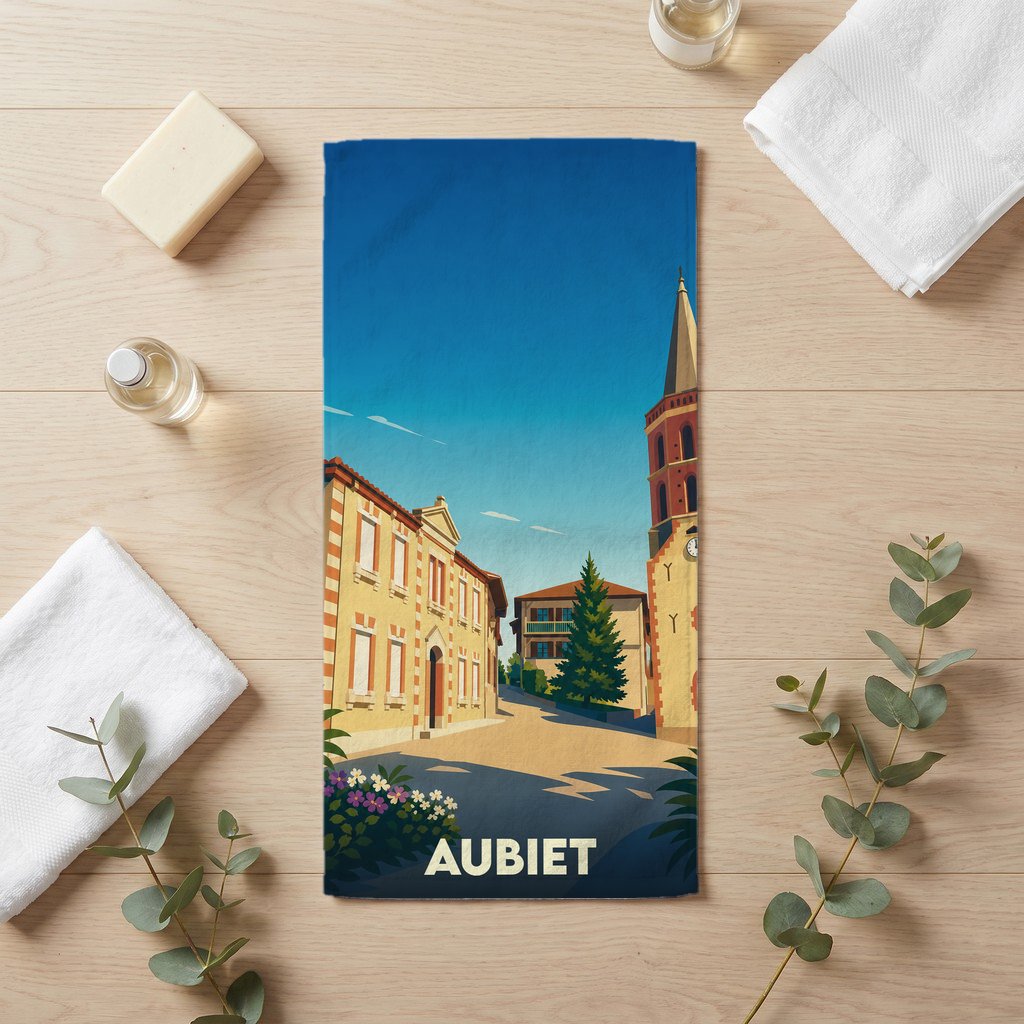 Serviette de bain souvenir de la ville d'Aubiet avec une illustration stylisée.