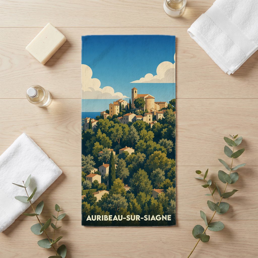 Serviette de bain souvenir de la ville d'Auribeau-sur-Siagne avec une illustration stylisée d'un village perché.