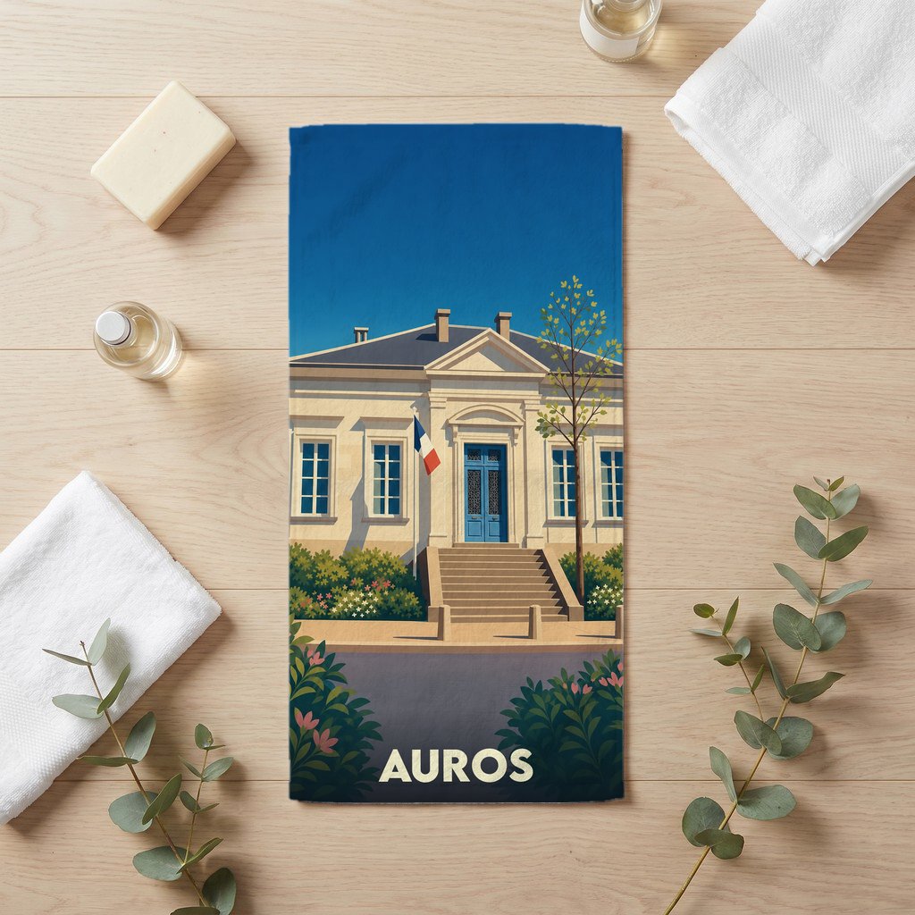 Serviette de bain souvenir de la ville d'Auros avec une illustration stylisée de sa mairie.