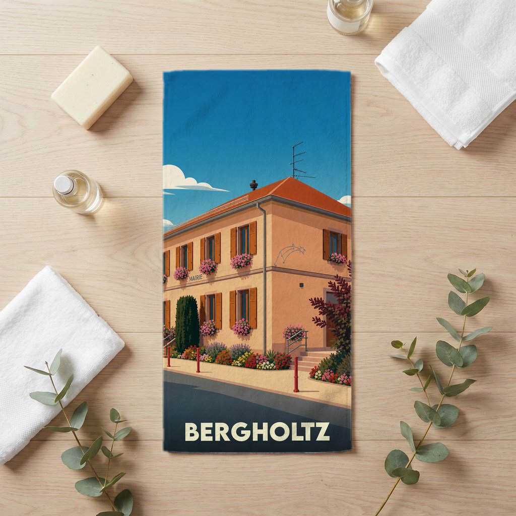 Serviette de bain souvenir de la ville de Bergholtz avec une illustration stylisée de la mairie fleurie.