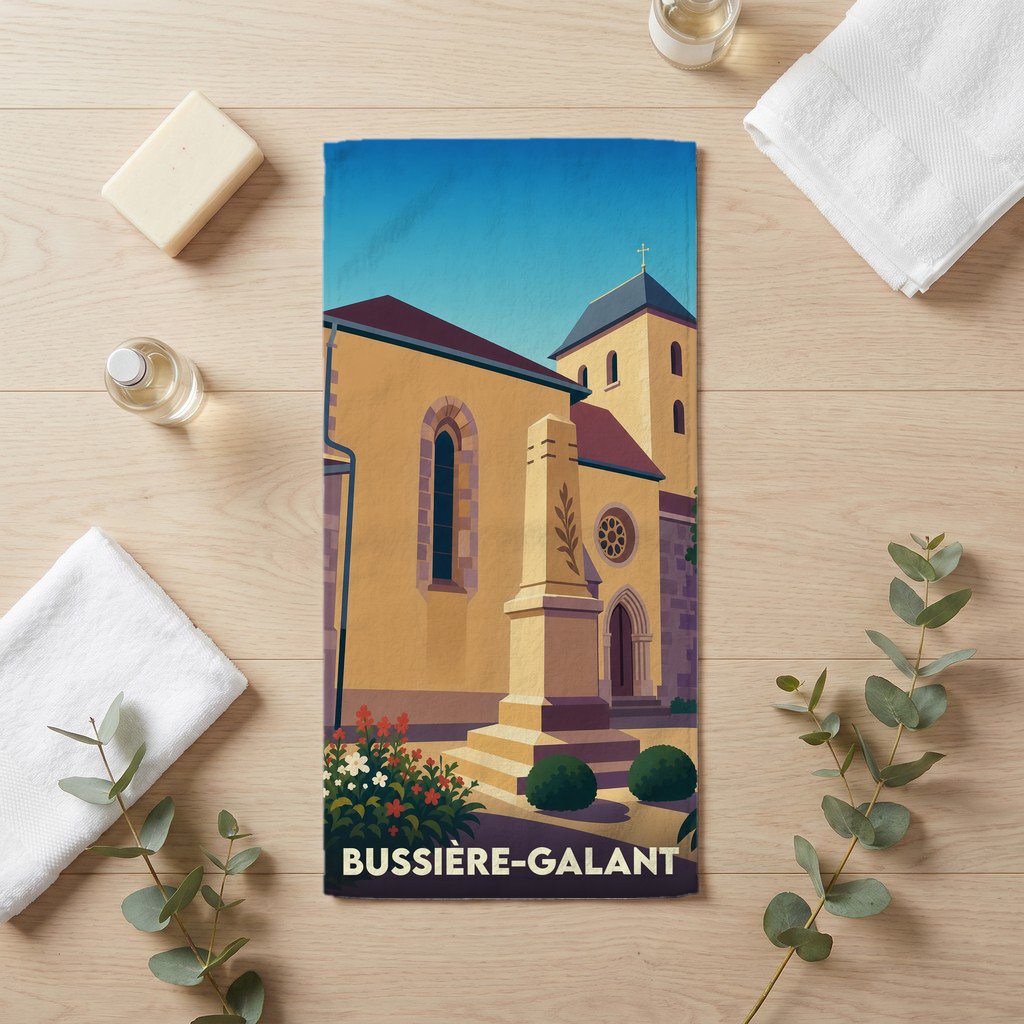 Serviette de bain souvenir de la ville de Bussière-Galant avec une illustration stylisée de son église.