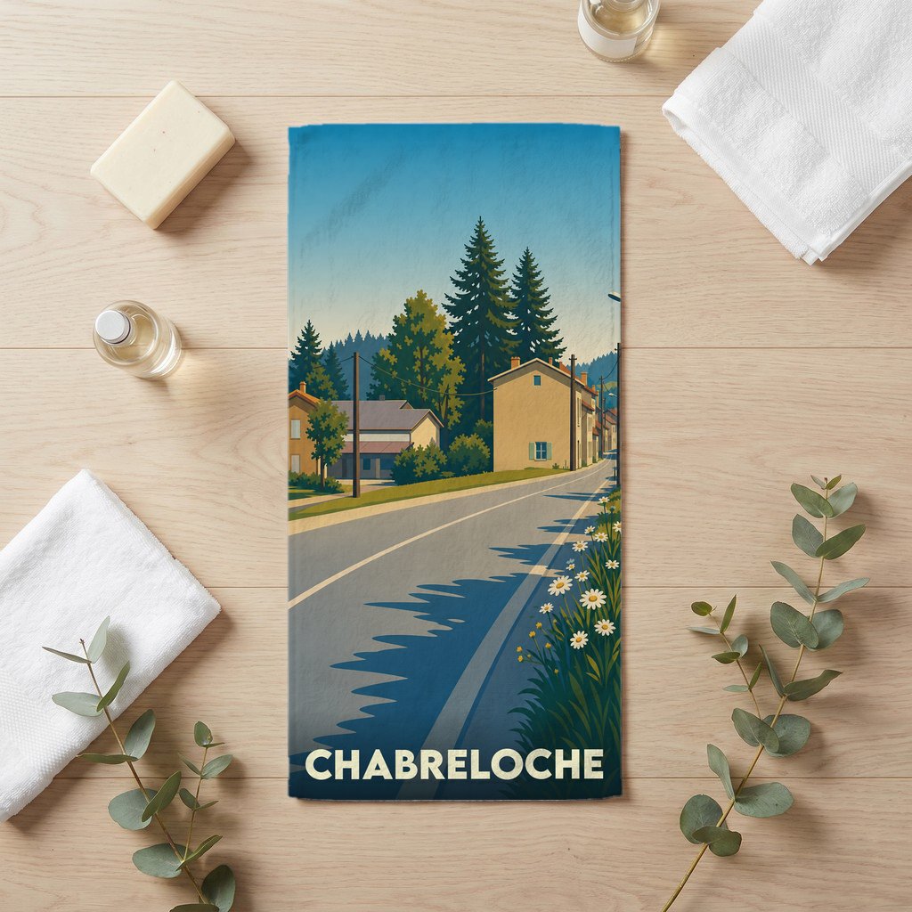 Serviette de bain souvenir de la ville de Chabreloche avec une illustration stylisée.