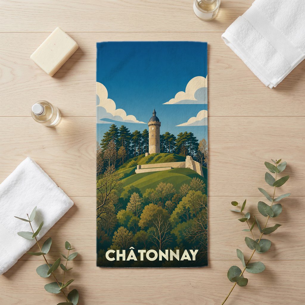 Serviette de bain souvenir de la ville de Châtonnay avec une illustration stylisée d'une tour sur une colline boisée.