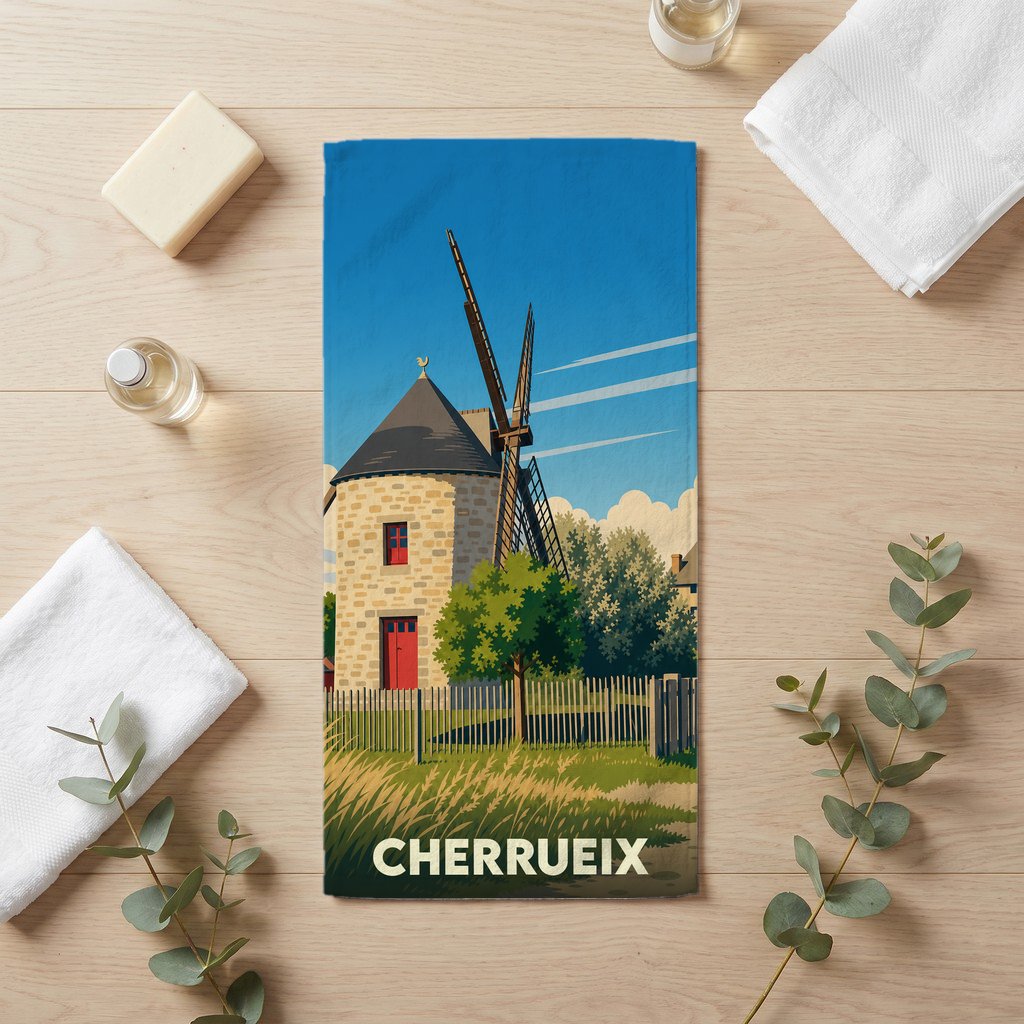 Serviette de bain souvenir de la ville de Cherrueix avec une illustration stylisée d'un moulin à vent breton.