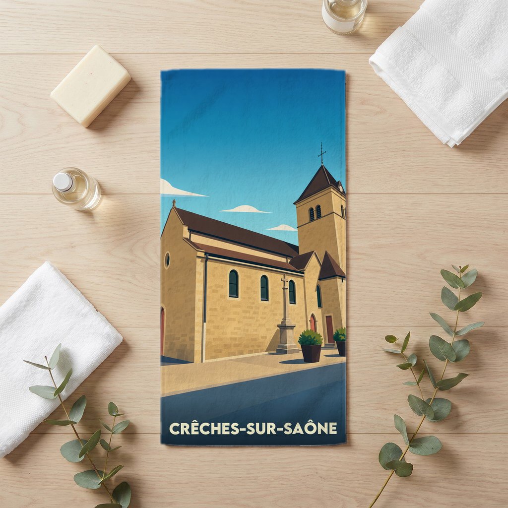 Serviette de bain souvenir de Crêches-sur-Saône avec une illustration stylisée de son église.