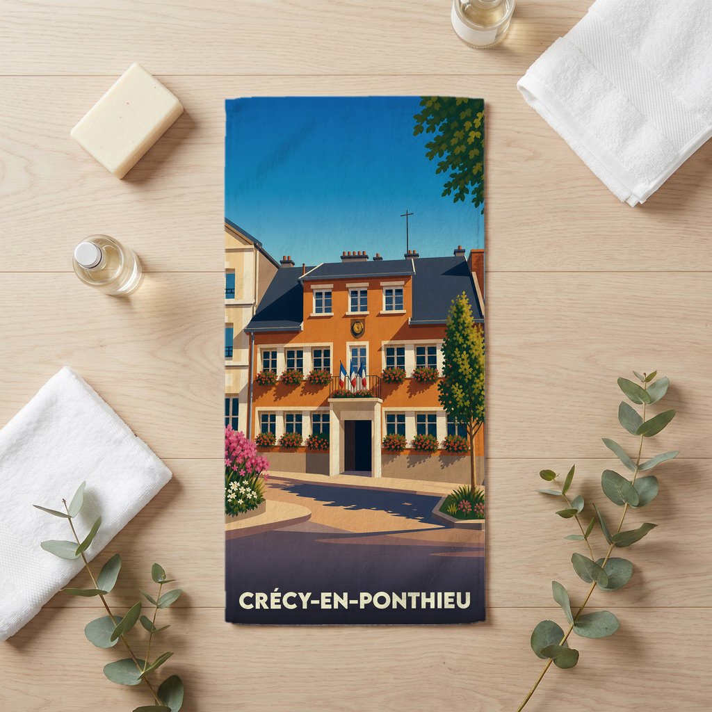 Serviette de bain souvenir de Crécy-en-Ponthieu avec une illustration stylisée de la ville.