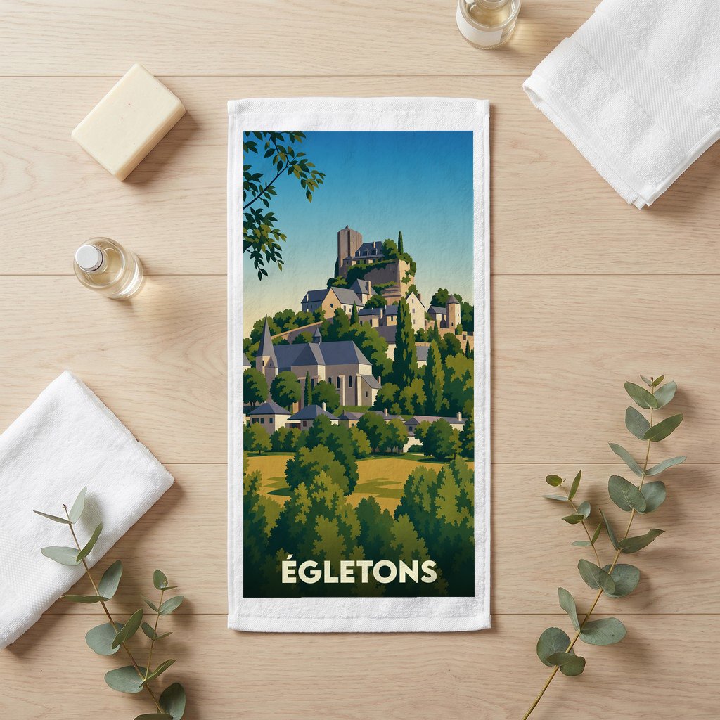 Serviette de bain souvenir de la ville d'Égletons avec une illustration stylisée de son paysage historique.