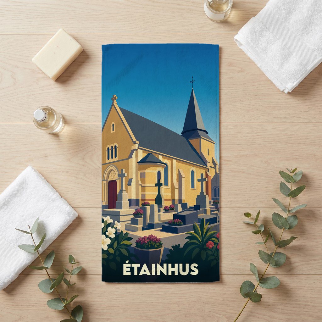 Serviette de bain souvenir de la ville d'Étainhus illustrée d'une église et de son cimetière dans un style graphique épuré.