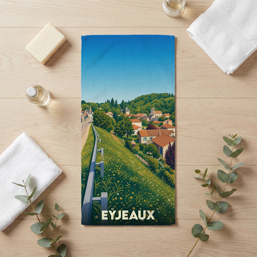 Serviette de bain souvenir de la ville d'Eyjeaux avec une illustration stylisée d'un paysage de campagne.