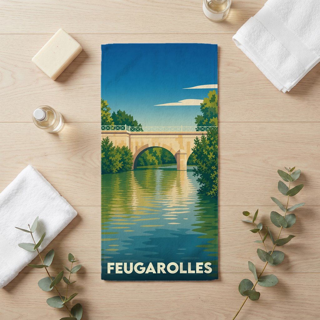 Serviette de bain souvenir de la ville de Feugarolles illustrée d'un pont au-dessus de l'eau dans un style rétro.