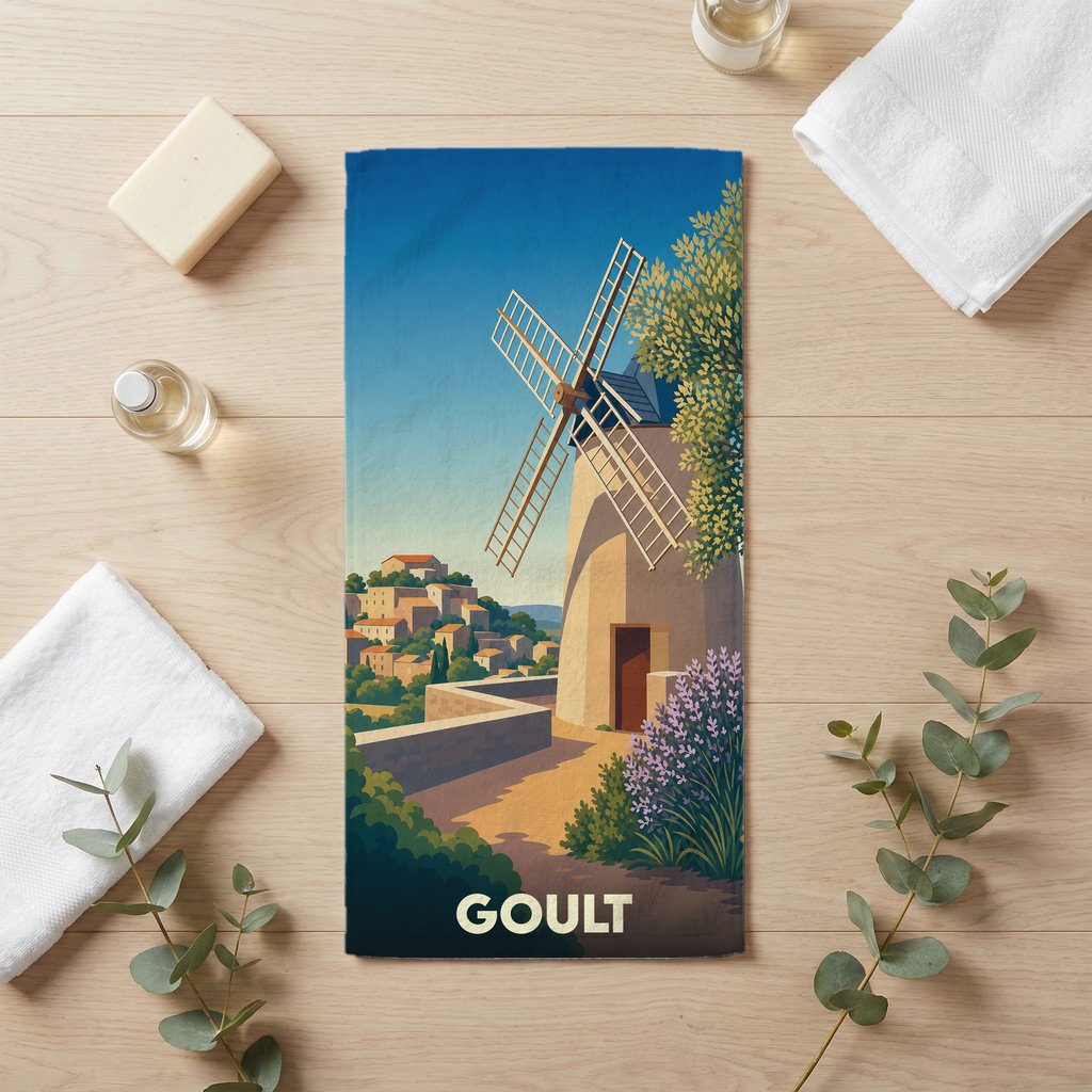 Serviette de bain souvenir de la ville de Goult avec une illustration stylisée d'un moulin provençal.