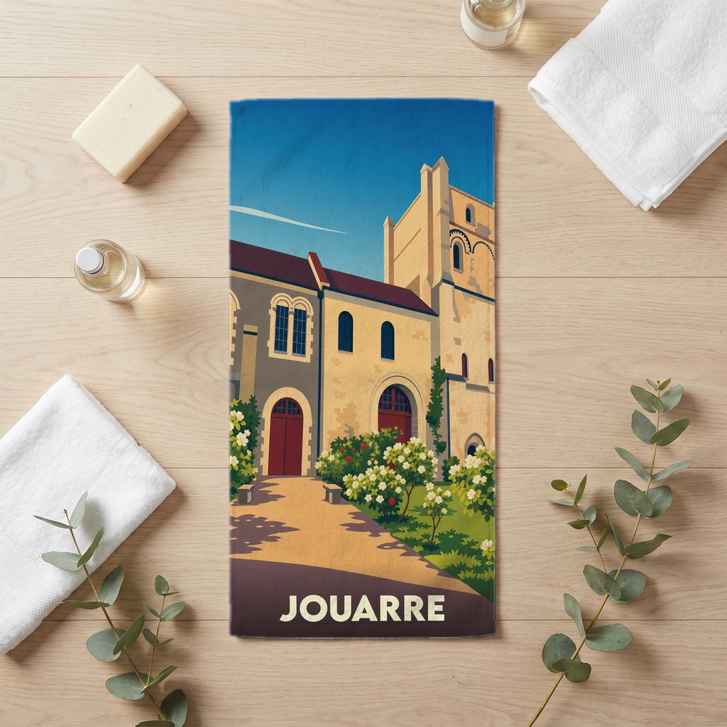 Serviette de bain souvenir de la ville de Jouarre avec une illustration stylisée d'une abbaye.
