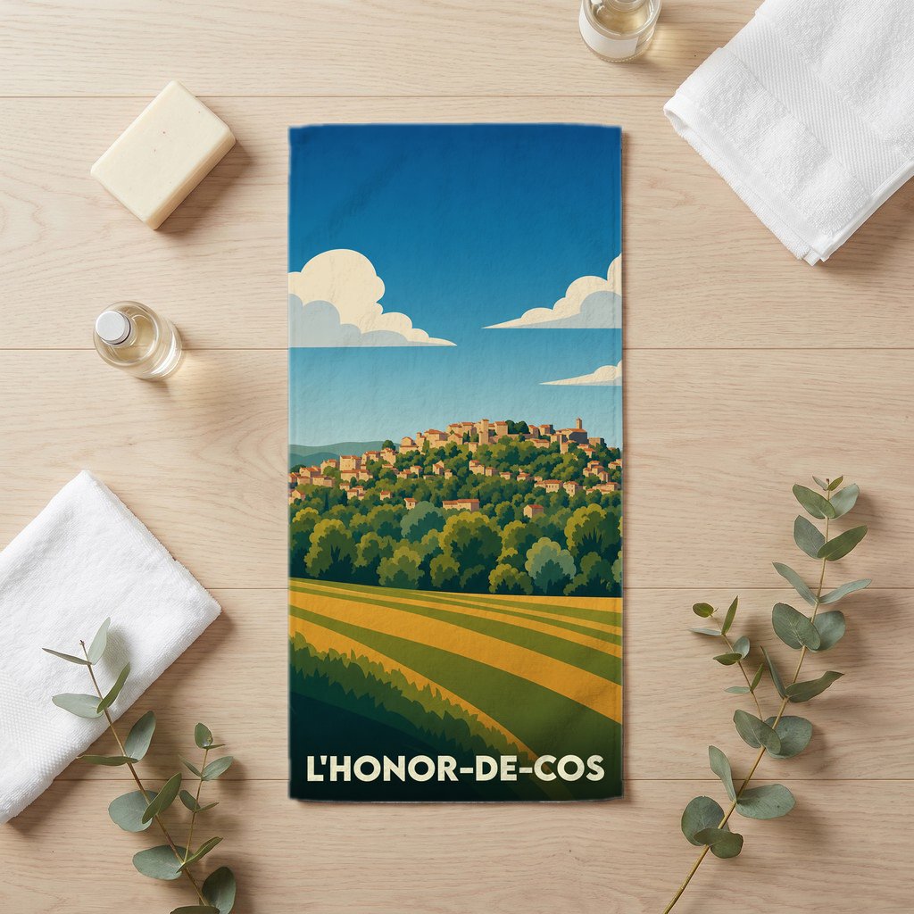 Serviette de bain souvenir de la ville de L'Honor-de-Cos avec une illustration de paysage stylisée.