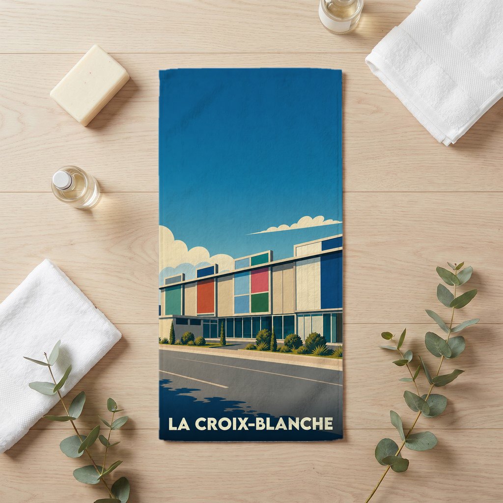 Serviette de bain souvenir de la ville de La Croix-Blanche avec une illustration architecturale colorée.