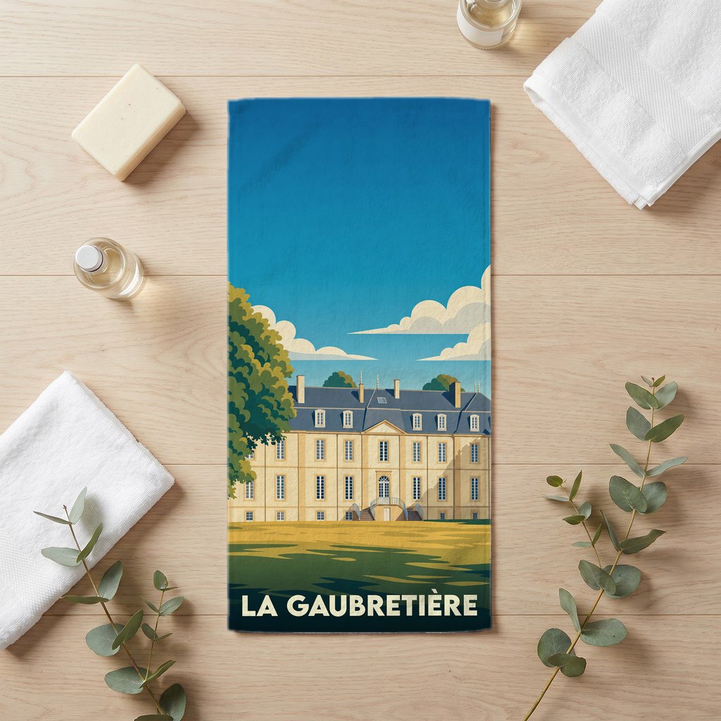 Serviette de bain souvenir de la ville de La Gaubretière avec une illustration stylisée d'un château.