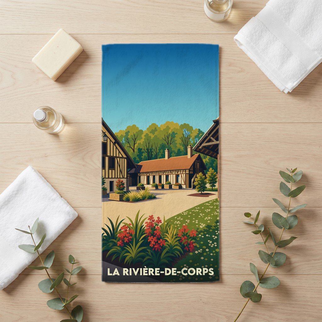 Serviette de bain souvenir de la ville de La Rivière-de-Corps avec une illustration stylisée de maisons à colombages.