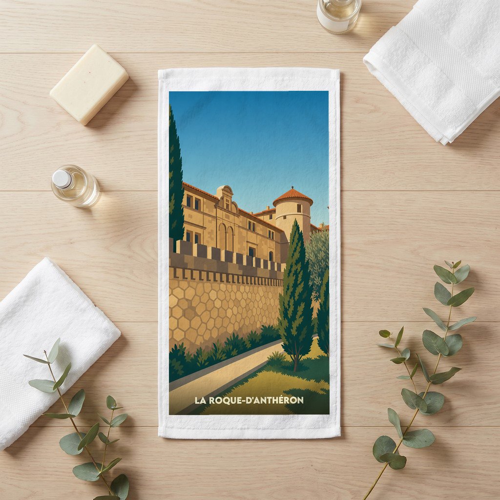 Serviette de bain souvenir de la ville de La Roque-d'Anthéron avec une illustration stylisée.