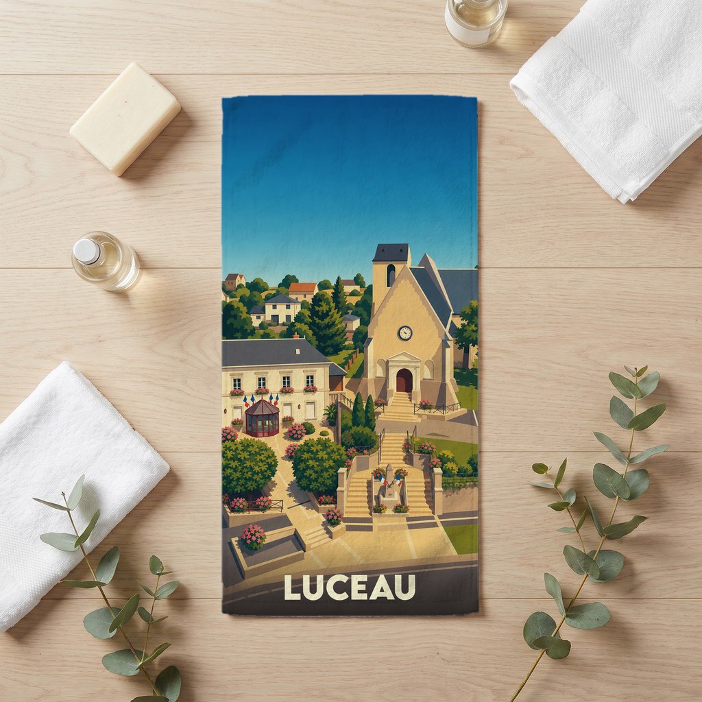 Serviette de bain souvenir de la ville de Luceau avec une illustration stylisée.