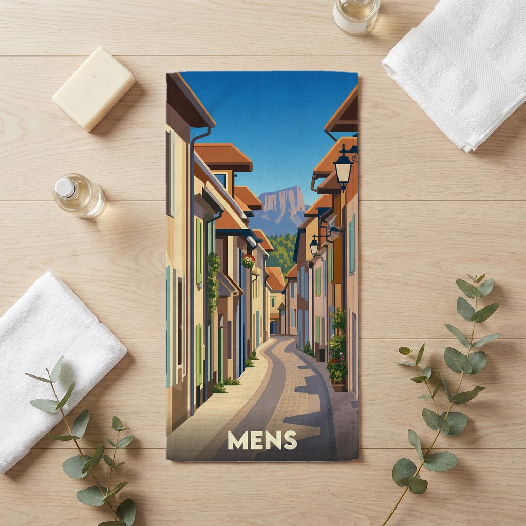 Serviette de bain souvenir de la ville de Mens avec une illustration stylisée d'une rue typique.