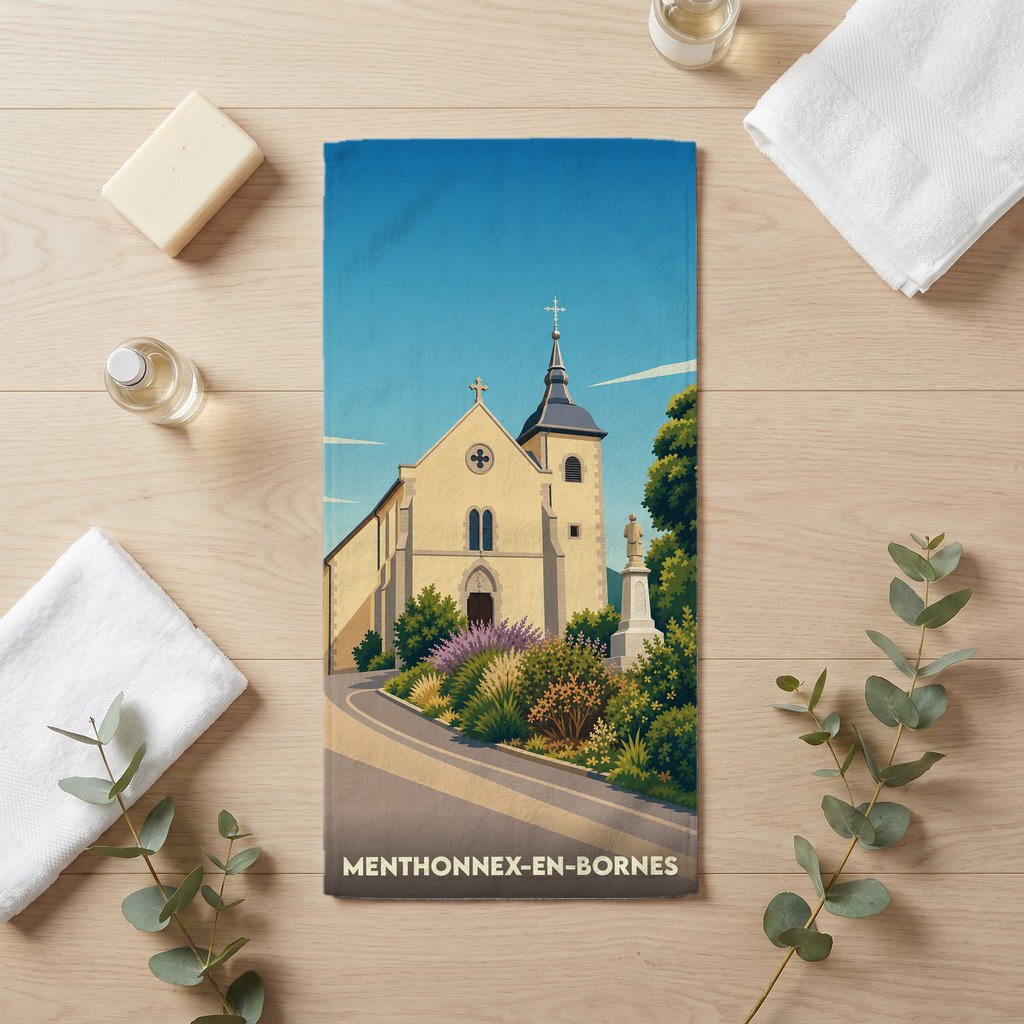 Serviette de bain souvenir de Menthonnex-en-Bornes avec une illustration stylisée de son église.