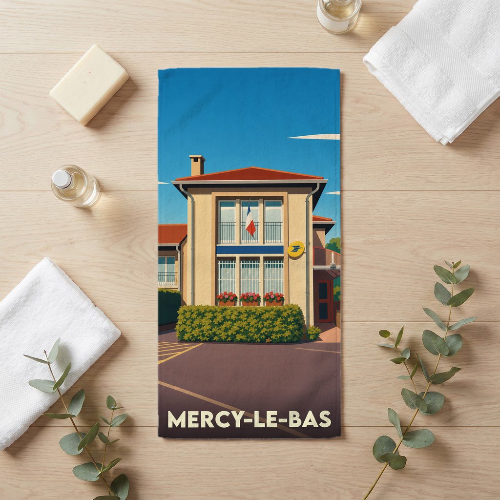 Serviette de bain souvenir de la ville de Mercy-le-Bas avec une illustration stylisée d'un bâtiment typique.