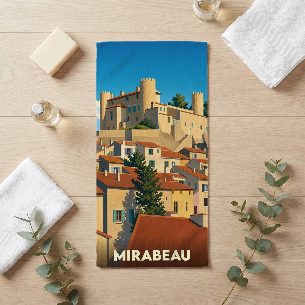 Serviette de bain souvenir de la ville de Mirabeau avec une illustration stylisée d'un village provençal et de son château.