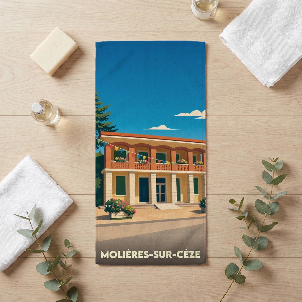 Serviette de bain souvenir de Molières-sur-Cèze avec une illustration stylisée d'un bâtiment provençal.