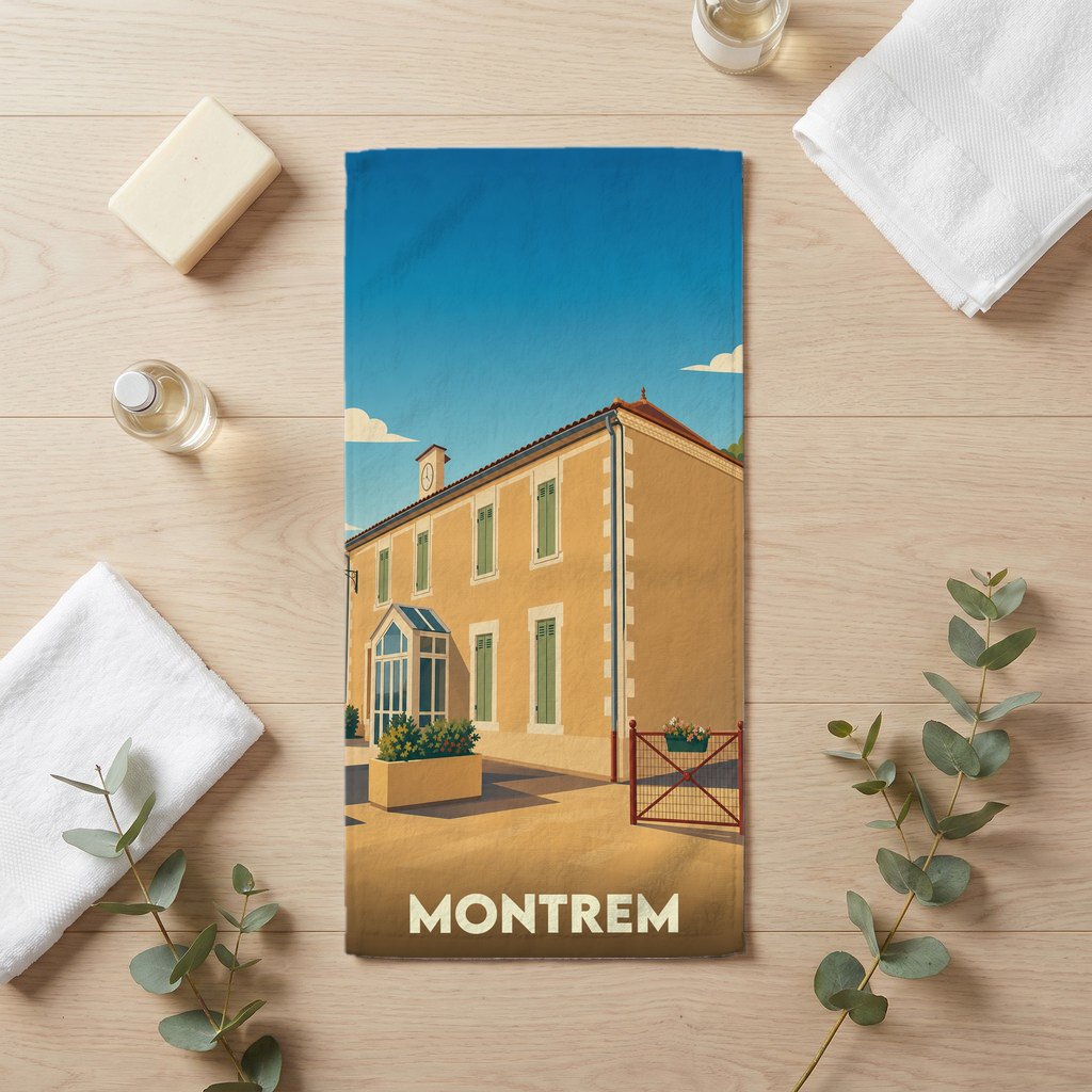 Serviette de bain souvenir de la ville de Montrem avec une illustration stylisée d'un bâtiment provençal.