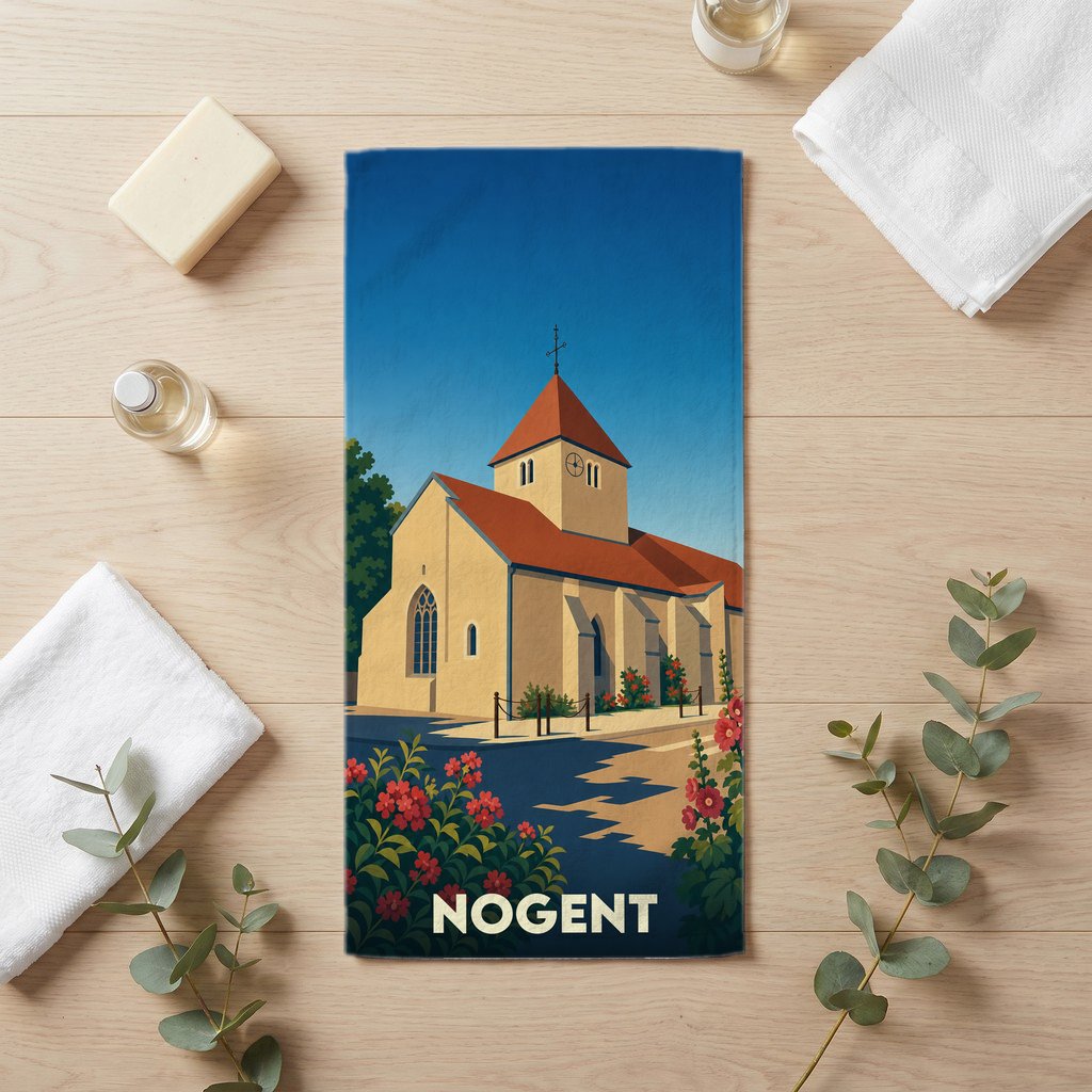 Serviette de bain souvenir de la ville de Nogent illustrée d'une église pittoresque sous un ciel bleu.