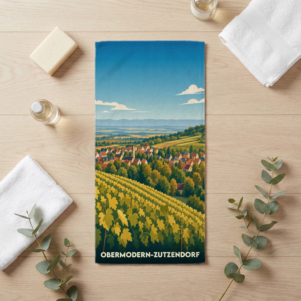 Serviette de bain souvenir de la ville de Obermodern-Zutzendorf avec une illustration stylisée de vignobles et du village.