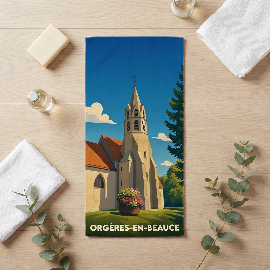 Serviette de bain souvenir de la ville d'Orgères-en-Beauce avec une illustration stylisée de son église.