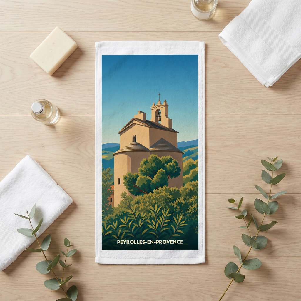 Serviette de bain souvenir de Peyrolles-en-Provence avec une illustration stylisée de sa chapelle.