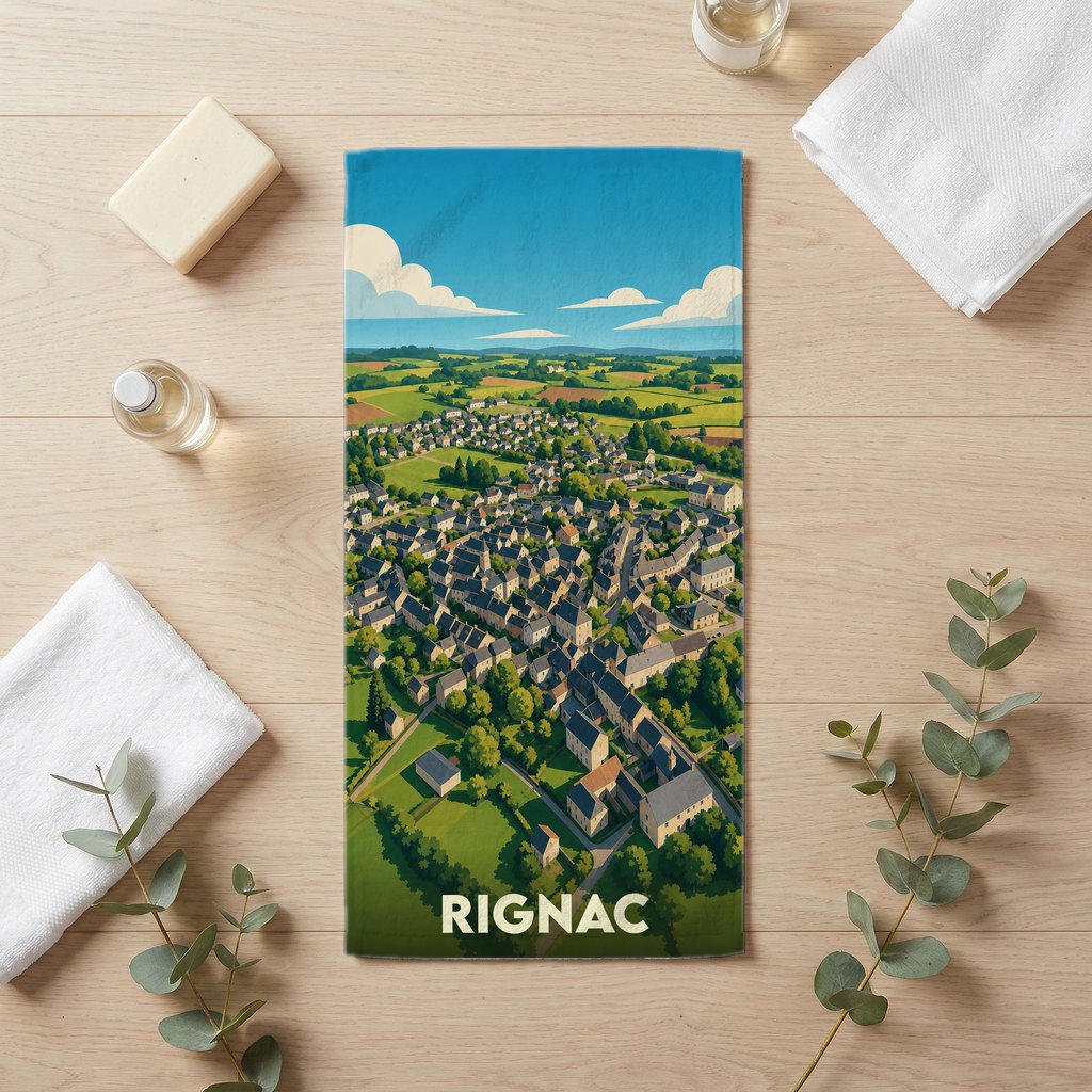 Serviette de bain souvenir de la ville de Rignac avec une illustration aérienne stylisée.